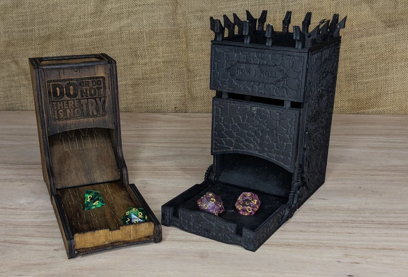 Wooden dice towers for tabletop gaming, including folding designs and castle-style towers in various finishes.